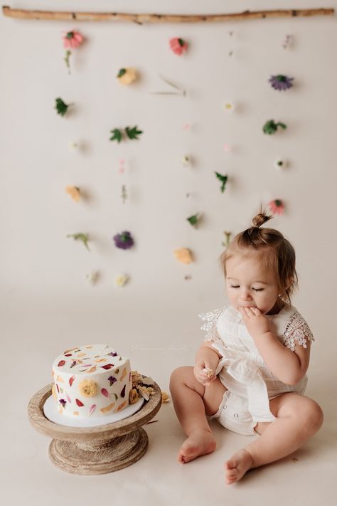 Bundt Smash Cake, 1st Birthday Flower Theme Photoshoot, Wildflower First Birthday Backdrop, Wildflower Cake Smash Photoshoot, Timeless First Birthday Photo, Flowery First Birthday, Floral 1st Birthday Photoshoot, Wildflower Cake Smash Photography, Wild Flower First Birthday Photoshoot