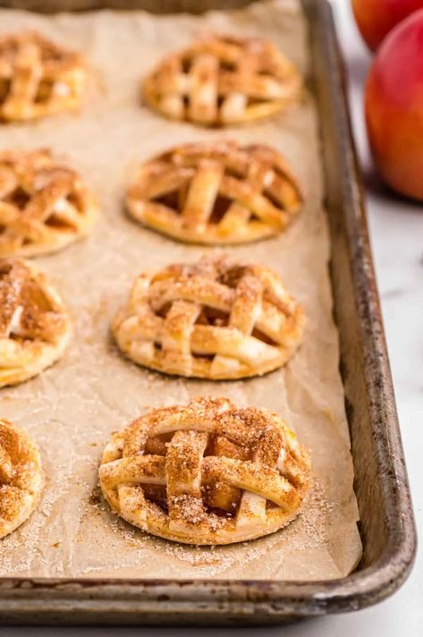 These apple pie cookies (a.k.a. mini apple pies) are made with pre-made refrigerated pie crust and a delicious homemade apple pie filling. Mini Apple Pies Homemade Crust, Easy Apple Pie Cookie Recipe, Apple Pie Crust Cookies, Apple Pie Appetizer, Meals To Make With Pie Crust, Pie Designs Easy, Mini Apple Pastries, Apple Rings With Pie Crust, Miniature Pies Recipe