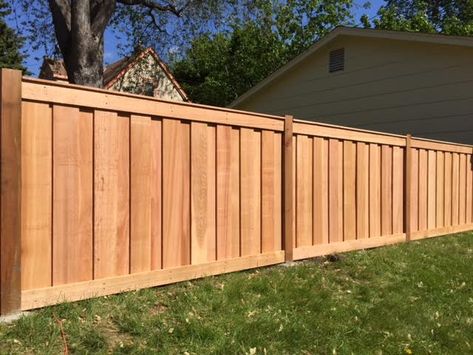 Cedar Picket Fences | MN Fence Installation Company | Dan's Fence Overlapping Fence Boards, Cedar Plank Fence, Cedar Picket Fence Ideas, Composite Wood Fence, Backyard Wood Fence Ideas, Vertical Privacy Fence, Vertical Wood Fence Design, Backyard Gates And Fences, Wood Privacy Fence Ideas