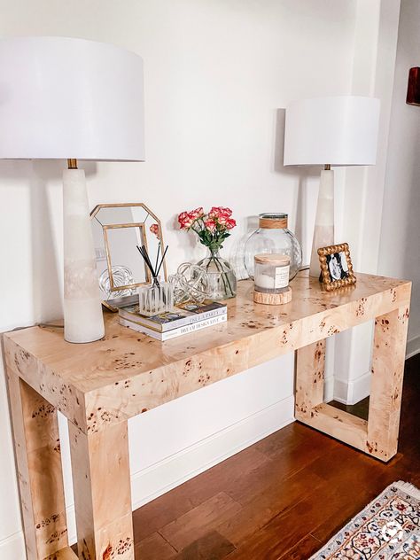 Entry way style with this burl wood console table. Still looking for the perfect mirror to hang above it but so obsessed with these lamps! . .  http://liketk.it/2UJYY #liketkit @liketoknow.it #StayHomeWithLTK #LTKhome #LTKstyletip @liketoknow.it.home  . . Entry way style - marble lamps - glass knot decor - coffee table books - burlwood console table Burled Wood Entry Way Table, Burlwood Living Room, Console Table Under Floating Shelves, Burlwood Entry Table, Desk As Entry Table, Burlwood Console Table, Glass Entry Table, Burled Wood Console Table, Burl Wood Console Table