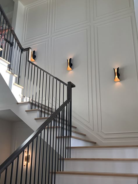 staircase wall decor ideas design Wall Trims For Staircase, 2 Story Paneled Walls, Home Stairwell Ideas, Molding On Staircase Wall, Stairs Wainscotting Modern, Stair Case Wall Design Interiors, Molding On Stairs Wall, Stair Wall Moulding Ideas, Tall Hallway Wall Decor Ideas