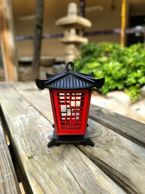 "We are so excited to introduce you to our small pagoda lantern collection! These small lanterns are made with a high quality maple wood, designed originally by us (made from scratch), laser cut and of course finished with passion (already assembled). They are painted with a premium house-blend cherry red & black acrylic paints. Also, they are coated with waterproof and UV protectant top, which make them perfect for outdoor use as well. They come in 3 sizes : Height and Width are proportional  Mini : 4\" inches Small: 5.5\" inches Medium: 7\" inches ⚠ Warning ⚠ \"These lanterns are intended for the use of LED candles only\" LED tealight candle is included with your order. Don't miss out! Buy the set and SAVE $5 If you want to take a look to our bigger style 😉 click on the link:  https://h Chinese Decorations Ideas, Japan Decoration, Small Pagoda, Lantern Japanese, Japanese Culture Art, Chinese Style Design, Wooden Lantern, Pagoda Lanterns, Japanese Lantern