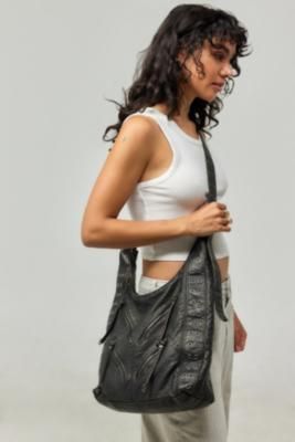 Add a utility-styled addition in this slouchy bag by BDG. Features a washed PU construction with zip fastenings and studded details, complete with a crossbody strap and a zip-up main compartment. Urban Outfitters exclusive. **Content + Care** \- 100% Polyurethane \- Wipe clean **Size** \- D: 10cm x W: 41cm x H: 28cm \- Strap drop: 69cm | BDG Washed Faux Leather Slouch Bag - Black at Urban Outfitters Leather Slouch Bag, Slouch Bag, Slouchy Bag, Slouch Bags, Black Fits, Crossbody Strap, Zip Up, Women's Accessories, Urban Outfitters