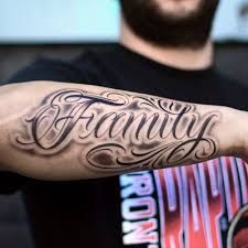 Top 250 Best Lettering Tattoos (October 2019) • Tattoodo Forearm Word Tattoo, Forearm Name Tattoos, Arm Tattoos Lettering, Family Name Tattoos, Family Tattoos For Men, Outer Forearm Tattoo, Names Tattoos For Men, Tattoo Lettering Styles, Cute Hand Tattoos