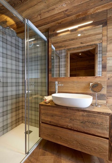 a cool chalet bathroom clad with wood, with a floating vanity, checked tiles in the shower space and a lit up mirror Chalet Bathroom, Treehouse Living, Mountain Interiors, Wc Design, Cabin Bedroom, Chalet Design, Cabin Bathrooms, Rustic Luxe, Rustic Bathroom Designs