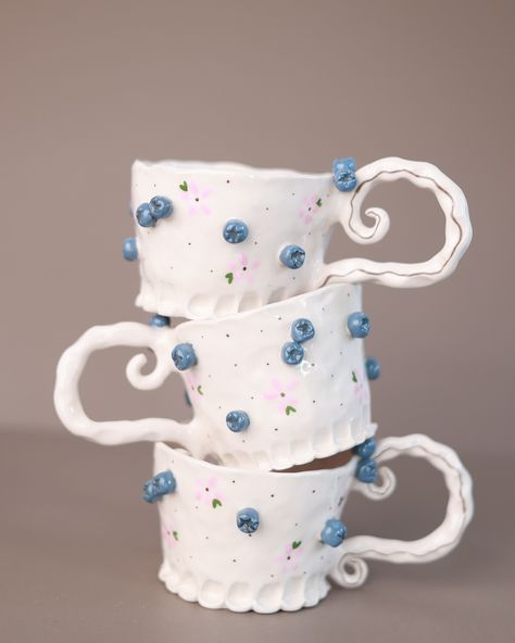 I’ve been thinking about this product for a long time. I spent a lot of time considering how to design it, and then suddenly the clay took shape in my hands—everything just came together in that moment. Sometimes, even when I plan carefully, something completely different emerges. That’s how this mug turned out. As a blueberry lover, it looks absolutely perfect with my morning coffee and pancake with jam. 🫐🫐🫐 #ceramic #ceramicmug #handmademug #ceramicgift #gift #giftshop #etsyshop #etsyceram... Cute Pottery, Unique Tea Cups, Heart Mug, Unique Tea, Handmade Mug, Cappuccino Cups, Mug Unique, Ceramic Gifts, Ceramic Dishes