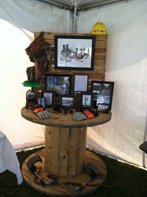 Display for my husband's Journeyman Lineman party. Also paid tribute to his Grandpa who was a Lineman that retired from PUD. The hooks & belt were originally his that my hubby used during his apprenticeship. #linemanlegacy #powerlineman #journeyman Rustic Retirement Party Ideas For Men, Lineman Centerpiece, Retirement Party For Electrician, Lineman Theme Party, Journeyman Lineman Party, Carpenter Birthday Party Ideas, Lineman Home Decor Ideas, Lineman Retirement Party Ideas, Lineman Party Ideas