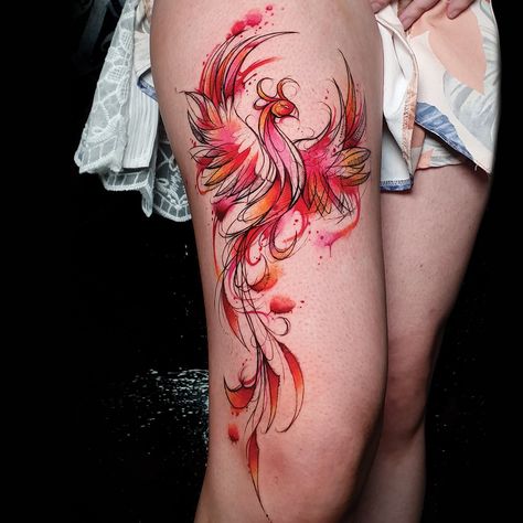 Vibrant red and orange inked phoenix tattoo on the thigh Pheonix Tattoo Watercolour, Rebirth Phoenix Tattoo, Phoenix Rising From Ashes Tattoo Women Thigh, Pheonix Thigh Tattoos Women, Phoenix Calf Tattoo, Phoenix Rising From Flames Tattoo, Watercolour Phoenix Tattoo, Phoniex Thigh Tattoo Women, Phoenix Upper Arm Tattoo