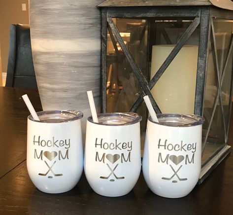 These colorful tumblers will make great gift for all. Great for your icy beverage or your hot drink. Hockey Mom engraved on this tumbler, a must for every hockey mom Great for a birthday, hockey tournament, Christmas gift.  What a great keepsake for anyone to have, their own hockey tumbler - 12 oz tumbler in your choice of color - 18/8 stainless Steel and with no BPA -Double wall vacuum insulated for hot and cold liquids -Clear plastic push on lid with opening for easy drinking  Care of tumbler To extend the life of your tumbler please hand wash,  *DO NOT PUT IN DISHWASHER* Hockey Mom Tumbler Cup, Coach Christmas Gifts, Hockey Crafts, Hockey Mom Gifts, Hockey Tournament, 12 Oz Tumbler, Engraved Ornaments, Mom Travel, Cadeau Parents