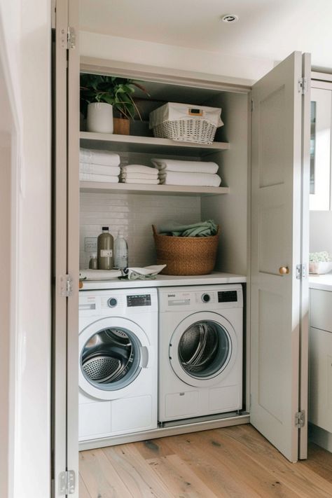 Laundry closet with washer, dryer, towels, and storage baskets. Boot Room Utility Entrance, Laundry Corner Small Spaces, Utility Extension Ideas, Utility Small Room Ideas, Utility Room Office, Utility Room Cupboard Ideas, Walk Through Utility Room, Small Kitchen Utility Ideas, Bootility Room Layout