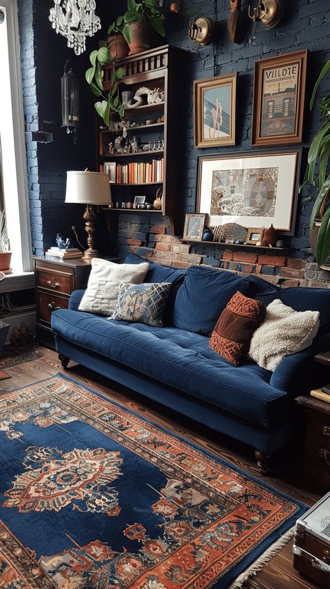 25 Blue Hues Living Room Decor Ideas For your Home Black White And Dark Blue Living Room, Moody Eccentric Living Room, Dark Blue Gallery Wall, Indigo Couch Living Room, Cosy Apartment Ideas, Dark Blue Lounge Room, Blue Painted Living Room Walls, Dark But Colorful Aesthetic, Blue And Brown Decorating Ideas