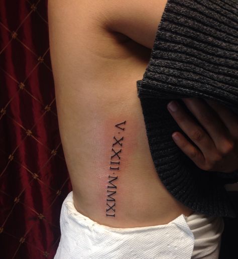 5.22.2011 Roman numerals tattoo on ribs Year Rib Tattoo, Roman Numeral Side Tattoo, Roman Numeral Tattoo On Ribs, Roman Numeral Date Tattoo, Trap Tattoo, Roman Numerals Tattoo, Numerals Tattoo, Tattoo On Ribs, Roman Numbers Tattoo