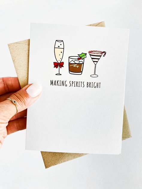 "Making Spirits Bright Card Holiday Card Funny Christmas Card Funny Holiday Card Christmas Cocktails Holiday Drink Christmas Cards Funny Card Card and Envelope specs: -A2 sized folded greeting card (4 1/4 \" x 5 1/2 \") printed on 110lb smooth white cardstock -A2 sized plain brown kraft square flap envelope (4 3/8\" x 5 3/4\") -Inside: BLANK (unless the + custom inside option has been chosen) If you choose the + custom inside option, please note that your message will be printed (not handwritten). Please leave a note with the order confirming your font choice (1, 2, or 3) along with the message you would like printed inside. I will send a mockup of the note via Etsy message for you to confirm before I send your order to print. *Custom inside is only available for orders of 100 cards and up Christmas Cards To Friends, Cheeky Christmas Cards, Funny Handmade Christmas Cards, Whimsical Christmas Cards, Christmas Pun Cards, Funny Diy Christmas Cards, Sarcastic Christmas Cards, Funny Christmas Card Ideas, Punny Christmas Cards