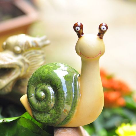 Enjoy the beauty of nature in your garden with gorgeous pottery painting that adds value to your outdoor space. Snail Garden, Snails In Garden, Pottery Houses, Animal Illustration Art, Garden Animals, Garden Pottery, Polymer Clay Animals, Hand Built Pottery, Ceramic Animals