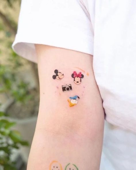 Disney Cute Tattoos, Disney D Tattoo, Its A Small World Tattoos, Subtle Disney Tattoos Simple, Disney Icon Tattoo, Simple Disney Tattoos Ideas, Disney Shoulder Tattoo, Rundisney Tattoo, Slinky Dog Tattoo