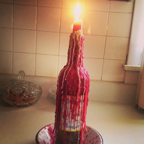 Wine bottle candle holder Melted Wine Bottles, Wine Bottle Candle Holder, Wine Bottle Candle, Bottle Candle Holder, Communal Living, Bottle Candle, Beer And Wine, Wine Bottle Candles, Lighted Wine Bottles