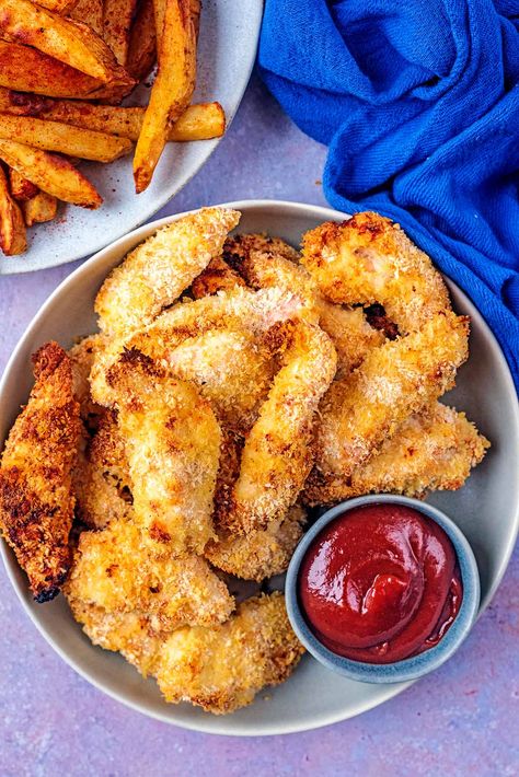 Juicy, tender and crispy baked chicken goujons. All the flavour of fried chicken, but baked instead for minimal effort and much healthier too. Crunchy chicken strips will be popular with adults and kids alike. They're so easy to make, you will never need to buy frozen chicken goujons again. Salmon Fishcakes, Chicken Goujons, Crunchy Chicken, Carrot Fries, Greek Potatoes, Crispy Baked Chicken, Chicken Strips, Frozen Chicken, Creamy Mashed Potatoes