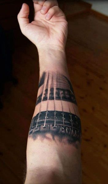 Realistic Tattoo by Bojan Tattoocream Curcic | Tattoo No. 1680 Nfl Tattoo, Guitar Tattoos, Guitar Tattoo Design, Music Notes Tattoo, Online Guitar Lessons, Guitar Tattoo, Music Tattoo Designs, Note Tattoo, Realistic Tattoo