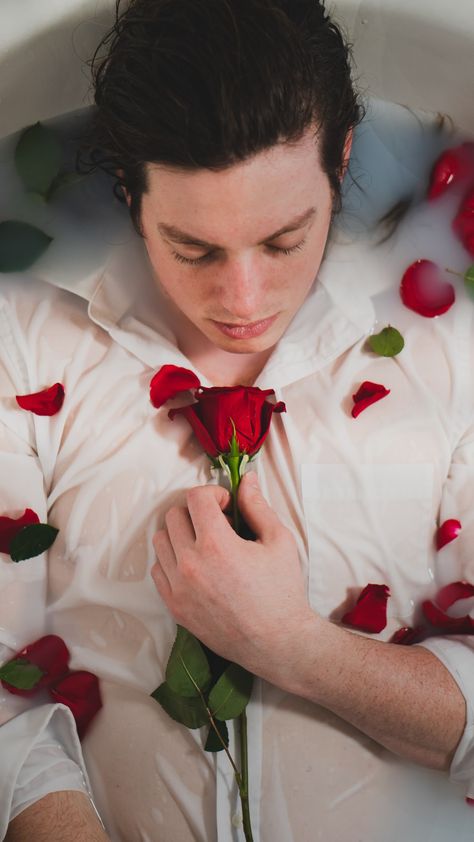 Man in bathtub with water and roses. Honestly one of the most interesting shoots I’ve done. Loved how the colors of the photos turned out! Photo: @porter.james.ellenburg #watershoot #roses #bathtubshoot #romance #fashion #milkywater #showershoot #portraitphotography #photographyart #minnesotaphotographer #minnesota #minneapolis #mensphotography #flowers #whiteshirt Bathtub Poses Men, Bathtub Photoshoot Men, Man In Bathtub, Bathtub Photoshoot Male, Mens Flower Photoshoot, Blood Bath Photography Tubs, Male Flower Photoshoot, Rainy City, Water Shoot