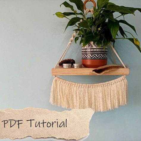 Macrame Shelf Wall Hanging PDF Tutorial (instant download) This digital download pattern lists the materials needed as well as a written step-by-step guide with photos on how to complete the piece and tips. The description is detailed (12 pages), it will be easy to follow. Perfect for Beginners! macrame shelf pdf tutorial pattern wall hanging plant hanger diy beginner level easy modern floating with fringe boho home decor Macrame Wall Shelf, Macrame Plant Hanger Pattern, Beginners Macrame, Plant Hanger Pattern, Diy Beginner, Macrame Shelf, Macrame Plant Hanger Patterns, Macrame Tutorials, Hanger Diy