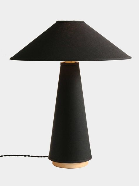 A contemporary table lamp with a linen shade and body, hardwood base, and brass details. The structural shape, distinct clean lines, and neutral tones are derived from classic mid-century modern design. Linen fabric gives a lustrous, glowing quality to create a serene atmosphere of ambient light. The understated look places emphasis on the high-quality materials. 
 Please note: Your payment does not include customs duties, local taxes or any other import costs. 
 If you have any questions about Mid Century Lamps Table, Linden Table Lamp, Night Table Lamps, Contemporary Table Lamp, Mid Century Table Lamp, Mid Century Lamp, Contemporary Table Lamps, Contemporary Table, Stylish Living Room