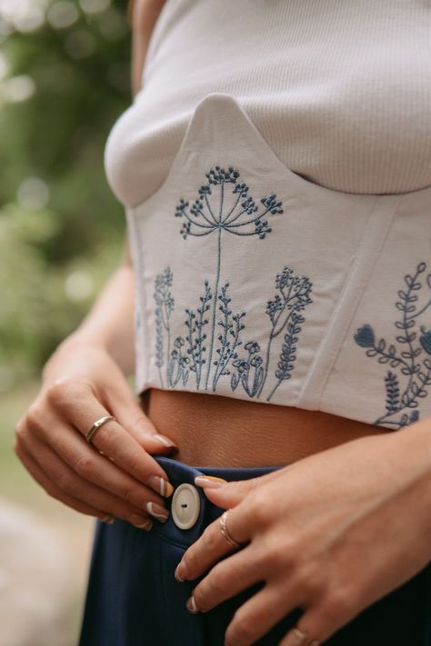 Place your order on our Etsy shop. Floral Aesthetic Underbust Linen Corset Embroidered Black White Bustier Eyelet and Grommet Closure Top. You can choose embroidery color from thread palette. #aestheticcorset #floralcorset #embroideredcorset #underbustcorset #aestheticbustier #linencorset #aestheticlothes #floralembroidery #whitecorset #blackcorset #beigecorset #bustier #linenclothes #handmadecorset #bohocorset #corsettop Embroidered Bustier Top, Embroidery Corset Top, Embroidered Corset Belt, Linen Corset Top, White Dress Embroidery, Corset Embroidery, Embroided Top, Blazer Embroidery, Embroidered Corset Top