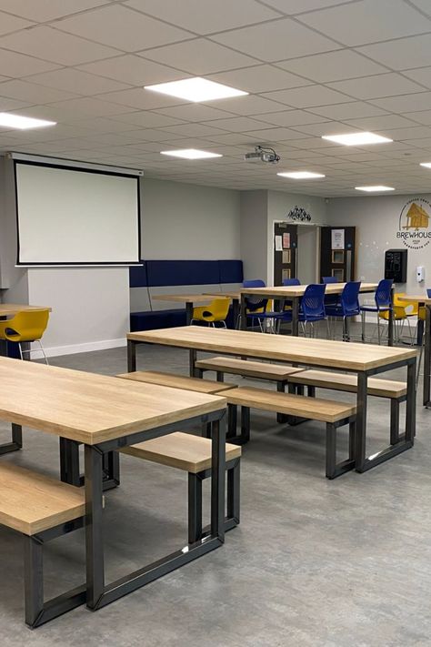 Sixth Form College common room furniture installation featuring various soft seating, bench tables, and stools. The Ferro bench table is an industrial styled bench table with oak effect surface. #college #academia #collegefurniture #furniture #canteenfurniture #canteen #canteendesign #fitout #furniturefitout #refit #refurbish #installation #furnitureinstallation College Furniture Design, Common Room Ideas College, Common Room College, School Benches Design, Canteen Design Ideas, College Common Room, Work Canteen, College Canteen, Pantry Table