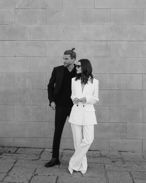 Couple In Suits Photoshoot, Pant Suit Engagement Photos, White Blazer Engagement Outfit, White Jumpsuit Engagement Photos, White Suit Engagement Photos, Wedding Suit Women Brides, Boss Couple Photoshoot, White Suit Wedding Women, Black And White Couple Outfits