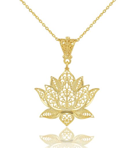 Unveil the elegance of serenity with our exquisite 925 Sterling Silver Filigree Art Women Lotus Flower Pendant! 🌸 Each detail is a tribute to the delicate artistry that transforms fine silver into a symbol of purity and enlightenment. Elevate your style with a touch of gold in this timeless piece, perfect for any look. The lotus charm comes with an adjustable 18”+2” silver chain, ensuring the perfect fit for any neck. Whether you're treating yourself or gifting a loved one, this necklace is ... Lotus Flower Pendant, Art Women, Flower Pendant Necklace, Sterling Silver Filigree, Gold Filigree, Touch Of Gold, Silver Filigree, Flower Pendant, Lotus Flower