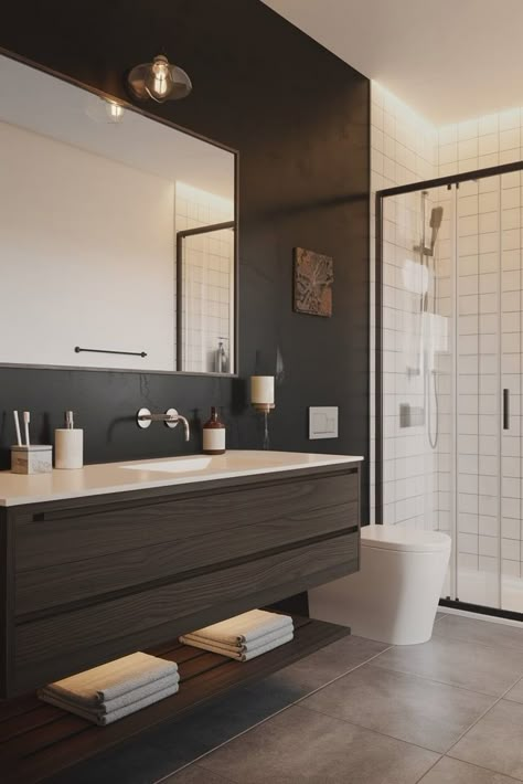 Less is more in this striking minimalist bathroom design featuring a dark wood floating vanity against a bold black accent wall. Pure contemporary elegance. #MinimalistDesign #FloatingVanity #ModernBathroom Dark Bathroom Wood Vanity, White And Dark Wood Bathroom, Dark Brown Wood Bathroom, Dark Brown Bathroom Vanity, Bathroom Dark Wood, Dark Wood Vanity, Dark Brown Bathroom, Brown Bathroom Vanity, Black Accent Wall