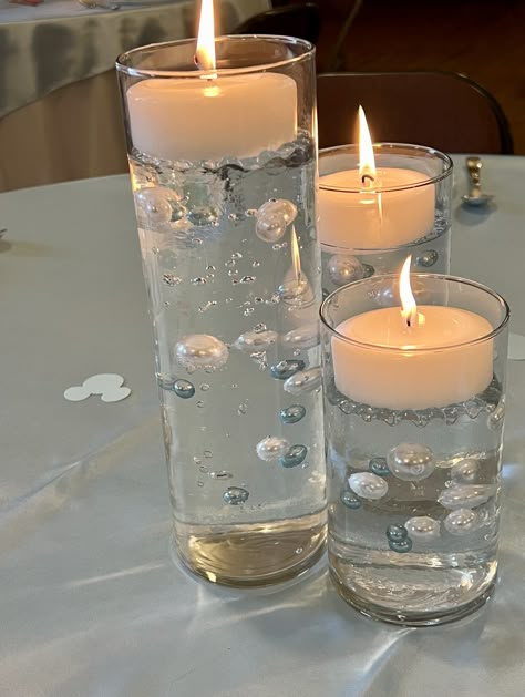 Floating Candles Floating Pearls, Floating Snowflake Centerpiece, Water Beads Ideas Diy Floating Candles, Floating Pearls Centerpiece, Pearl Candle Centerpiece, Floating Vases, Blue Floating Candles, Snowflake Wedding Theme, Water Centerpieces