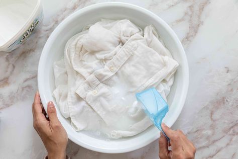 White clothes can turn yellow with age. Learn what methods will help whiten clothes that have yellowed without using bleach. Whiten White Clothes, Whiten Clothes, Cleaning White Clothes, How To Bleach Whites, How To Whiten Clothes, Remove Yellow Stains, Washing White Clothes, Bleaching Clothes, Brighten Whites