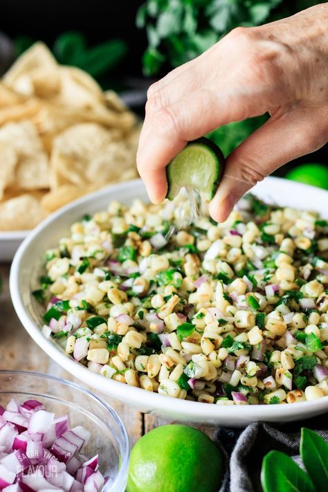 Copycat Chipotle corn salsa is sweet, a little spicy, and totally addicting.  Learn how to make our homemade twist on this popular Mexican restaurant's recipe.  Roasted poblano, sweet white corn, jalapeno, red onion, fresh cilantro, and lime juice come together to make this vegan and gluten free salsa to serve with burrito bowls, tacos or salads. Copycat Chipotle Corn, Gluten Free Salsa, Corn Jalapeno, Chipotle Corn Salsa, Chipotle Corn, Chipotle Copycat Recipes, Chipotle Copycat, Vegetarian Mexican Recipes, Copycat Chipotle