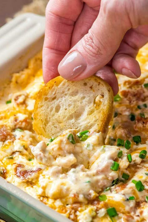 Boudin Dip! This Louisiana-inspired Boudin dip is baked hot and bubbly with spicy Boudin Cajun sausage, a mix of cheeses, and sour cream. Perfect for parties or game day! | HomemadeHooplah.com Boudin Dip Cream Cheese, Cajun Finger Foods For Party, Cajun Finger Foods, Cajun Appetizers Louisiana Finger Foods, Boudain Dip, Boudain Dip Recipe, Boudin Dip Recipe, Cajun Dip, Boudin Dip