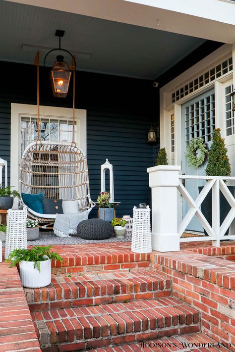 front-porch-swing-outdoor-decor-brick-steps-outdoor-lighting-plants-lanterns Light Blue House Exterior, Blustery Sky, Blue Home Exterior, Blue Exterior House Colors, Light Blue Houses, Brick Porch, Front Porch Swing, Brick Steps, Paint Blue