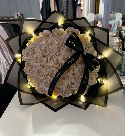 Beautiful eternal flowers bouquet with dior ribbon bow ✨🎀🖤 Brown Bouquet Aesthetic, Custom Rose Bouquet, 20 Count Rose Bouquet, Simple Prom Flowers Bouquets, Flower Inspo Bouquet, Internal Flowers Bouquet Ribbon, Bow Flower Bouquet, Eternal Ribbon Roses Bouquet, Valentines Ribbon Bouquet