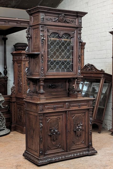 Description of item for sale: This beautiful buffet is from France and dates to the late 1800's or early 1900's.  It is Black Forest/Hunt style with lovely floral patterns.  It's made from oak finished to a medium/dark color.  This cabinet is in very good antique condition with only very minor nicks and scratches typical of 100+ years of gentle use.  The original stained/leaded glass is also undamaged.  As we do with all of our furniture, we finished it with a coat of antique grade paste wax that will maintain its beauty for years to come.  Dimensions: 96" high, 43.5" wide and 21" deep (front to back).  (DLT-0020) We welcome Local Inspections and Pickups: If you live in the area, you're welcome to come by to check out items we're auctioning and to pick up your purchases with no shipping or Dark Vintage Furniture, 1880s Furniture, Antique House Aesthetic, 1800 Furniture, Dark Academia Furniture, 18th Century Decor, Antique House Interior, 1800s Bedroom, 1900 Furniture