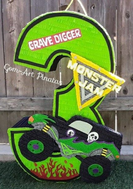 Two Tier Monster Truck Cake, Grave Digger Pinata, Grave Digger Birthday Party Decoration, Three Year Old Monster Truck Birthday, Monster Truck Pinata Diy, Monster Jam 3rd Birthday, Monster Jam Pinata, Monster Truck Photo Shoot, Monster Truck Centerpieces Ideas