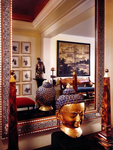 This Asian inspired design features a large decorative mirror, which reveals an entryway with gallery walls of framed artwork, statues and exotic accessories as well as formal bench seating. Large Mirror Decor, Scandinavian Christmas Trees, Mid Century Modern Wall Decor, Asian Interior Design, Asian Sculptures, Scandinavian Christmas Decorations, Buddha Decor, Asian Interior, Entry Design