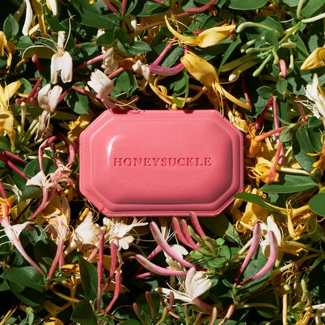 Gentle and moisturizing, our soaps are triple-milled to provide a luxurious lather and contain plant-based glycerin to nourish and protect skin from over-drying. With notes of sweet ambrosia and mossy forest, our Honeysuckle fragrance is a true fresh feminine floral, framed by uplifting top notes of juicy mandarin and neroli. Living Floral Honeysuckle and orange flower form a lush bouquet at the heart, leading to a serenely beautiful dry-down of velvet moss and sheer musk. Shop our complete Hone Soap Bar, Lush Aesthetic, Floral Soap, Luxury Bar, Luxury Soap, Bath Soap, Best Soap, Sweet Scents, Graphic Design Advertising