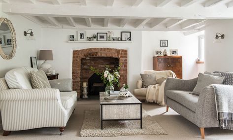 This charming Devon cottage has been transformed into the perfect space for family gatherings Country Living Room Carpet, Country Cottage Carpet, White Beams Living Room, Painted Beams Cottage, Cottage Beams, Country Chic Decorating, Sitting Room Lighting, Irish Cottage Interiors, Cottage Sitting Room