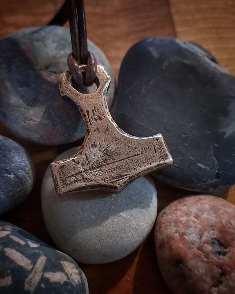 Mjölnir, the mighty hammer of Þorr, protector of mankind. This bronze pendant is all made by hand from old copper and tin. It has no historic background, but it's made the same way as in ancient times. The raw casted piece was filed, stamped and polished by hand with no power tools. One piece available #ulvgart #handcasted #bronzejewelry #bronzependant #amulet #Thor #mjolnir #mjölnir #bronzesmith #oldpath Thor Mjolnir, Bronze Jewelry, Bronze Pendant, The Mighty, Ancient Times, Blacksmithing, Power Tools, Thor, Tin