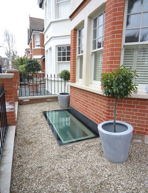 A glass basement fire escape at the front of a period house. 2.6m by 1.1m.  By meia - Moving Elements in Architecture.  meia.co.uk Uk Cellar Conversion, Basement Window Exterior, Cellar Window Ideas, Basement Light Well Ideas, Basement Windows Exterior, Victorian Basement Conversion, Victorian Cellar Conversion Ideas, Cellar Conversion Ideas, Cellar Window