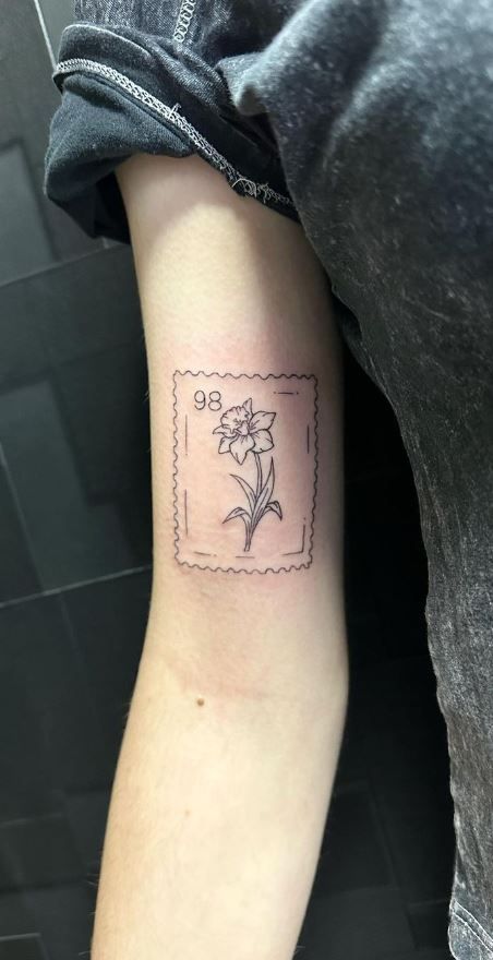 Daffodil Tattoo With Date, Stamp Tattoo Daffodil, Easter Flower Tattoo, Daffodil Carnation Tattoo, Daffodil Postage Stamp Tattoo, Golden Rod Flower Tattoo, Daffodil Arm Wrap Tattoo, Unique Daffodil Tattoo, Tattoo Ideas Female Daffodil