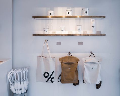 Arabica coffee shop in Hong Kong, interior view of merchandise wall Cafe Merchandise Display, Coffee Merchandise Ideas, Coffee Shop Merchandise Ideas, Coffee Shop Merchandise Display, Coffee Shop Merchandise, Cafe Merchandise, Kong Kong, Coffee Minimalist, Expo Display