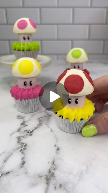 Rachel Lindsay on Instagram: "Buttercream Toads 🍄

I used a silicone cake pop mold to make these 
Pipe coloured buttercream dots into your silicone mold
FREEZE 🥶 for 15 minutes
Add white buttercream into the mold, followed by your marshmallows 
FREEZE 🥶 again for 15 minutes.
Push them out of the mold and keep them in the fridge until you’re ready to use 🍄
I used black buttercream and mini white sprinkles for the eyes. 
Sit your toads on top of mini cupcakes ✨ VOILA 🩷💛💚❤️

#cupcakes #toad #supermario #cakedbyrach #cakeart #cupcakedecorating #cutecake" Black Buttercream, Specialty Cupcakes, Buttercream Cake Designs, Rachel Lindsay, Cake Pop Molds, White Buttercream, Brownie Cupcakes, Mini Bundt Cakes, Cupcake Icing