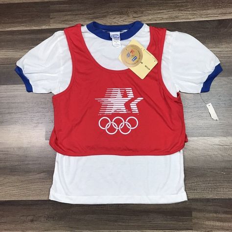 Vintage Levi's Womenswear Junior Ringer T-Shirt Usa Olympics 1984 Los Angeles. New Old Stock. Very Rare. The Red Top Is Sewn With The Ringer At The Shoulders Very Unique. Please Compare Measurements To Your Favorite Garments. Pit To Pit Roughly 16 Inches. Shoulder To Hem Roughly 23 Inches. We Try Our Best To Accurately Describe And Picture The Product Accurately. Vintage Olympics Shirt, Lego Shirts, 90s Culture, 1984 Olympics, Tee Ideas, The Ringer, Culture Fashion, Sports Logo Design, Levis T Shirt