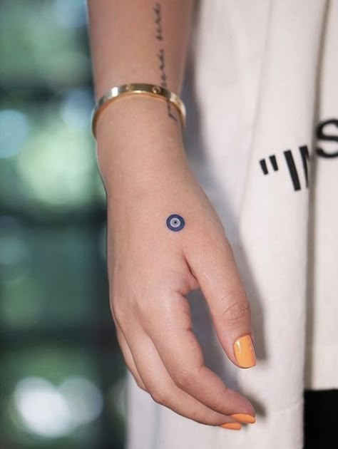 13 Small Evil Eye Tattoo Designs: Ward Off Negativity in Style Small Evil Eye Tattoo, Arm Tattoos For Women Forearm, Tattoo Design For Hand, Evil Eye Tattoo, Finger Tattoo For Women, Wrist Tattoos For Guys, Small Hand Tattoos, Arm Tattoos For Women, Discreet Tattoos