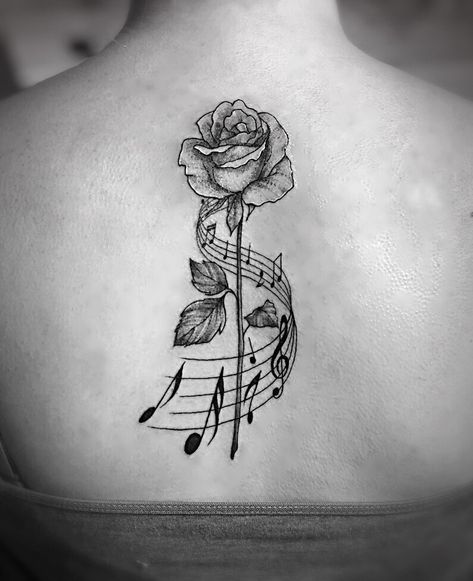 Rose and music note back tattoo #rose #staff #music #notes #back #tattoo #musicnotes #shading #linework #blackandgrey Staff Tattoo, Music Staff Tattoo, Small Music Tattoos, Notes Tattoo, Staff Music, Wörter Tattoos, Dance Tattoo, Music Notes Tattoo, Tattoo Music