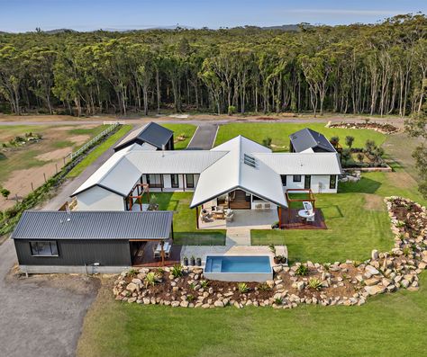 The design concept aimed for the beautiful Anna Bay Modern Farmhouse. Roofing made from #COLORBONDsteel in the colour #Monument using a #Trimdeck profile, was selected for the Master Bedroom suite, Garage, and Pool House, while COLORBOND® steel in the colour #Surfmist graces the primary section of the house. Fasçia and gutters throughout all roof areas feature Monument®. The Garage door is elegantly finished in #Nightsky. #BakkerDesign #BakkerHomes Port Stephens, Scandinavian Architecture, Modern Farmhouse Design, Terrace Design, Farmhouse Exterior, Farmhouse Style House, Building Plans, Villa Design, Bedroom Suite